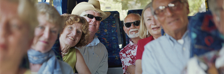 medicare_cover_750x250.jpg Image of seniors on a group tour bus