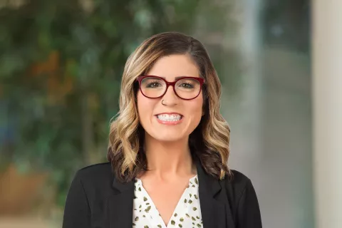 A professional portrait of Katie Myers.