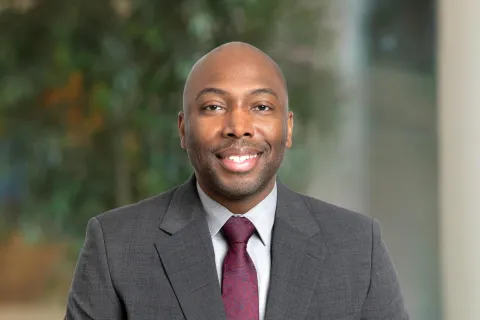 A professional portrait of Al Reed