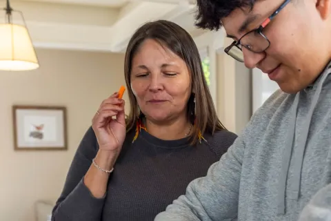 Two people prepare food