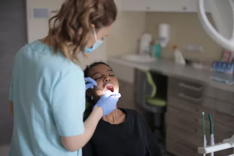 Dentist examining a child's mouth.