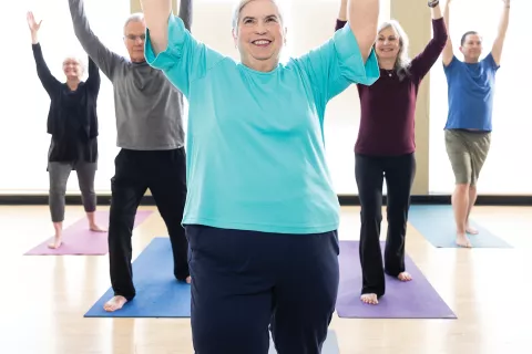 A group practices yoga.