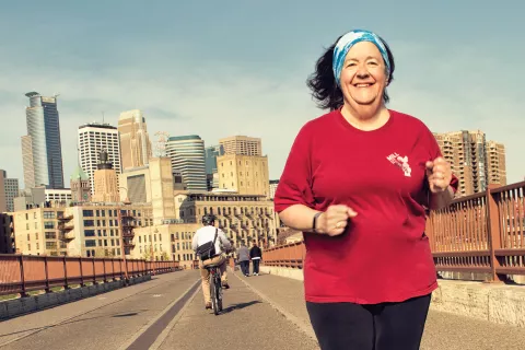 Claudia running on bridge