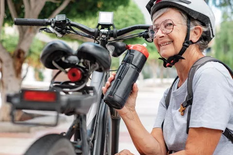 Woman takes a break from cycling.