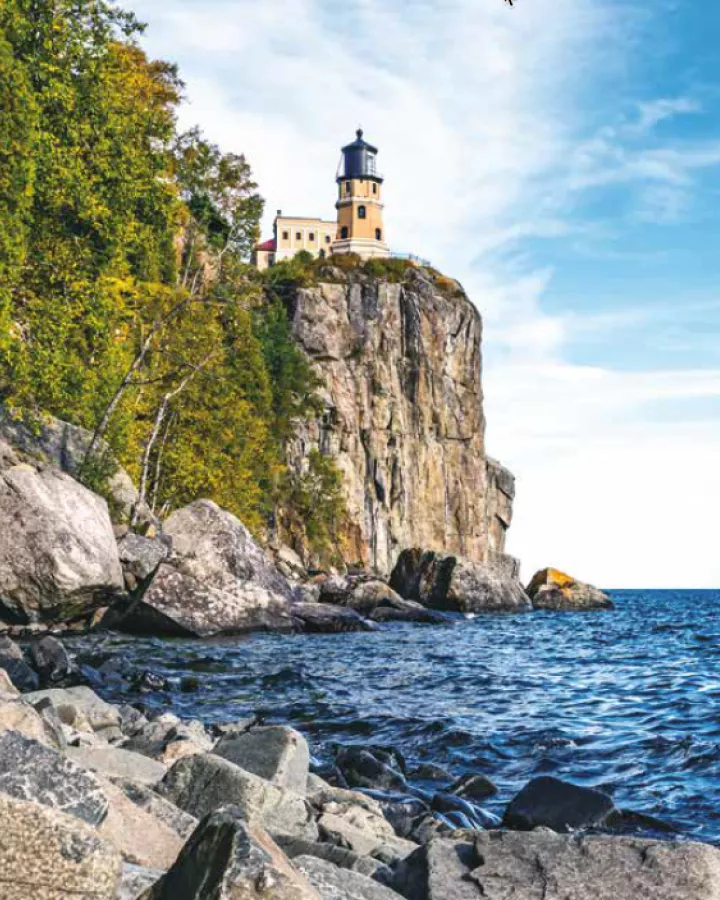 Lighthouse on rocky cliff