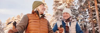 A couple walks in the woods.