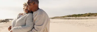 A couple hugs at the beach.