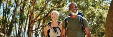 A couple takes a walk in the woods