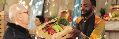Man purchases vegetables.