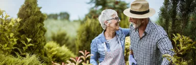 A couple works in their garden.